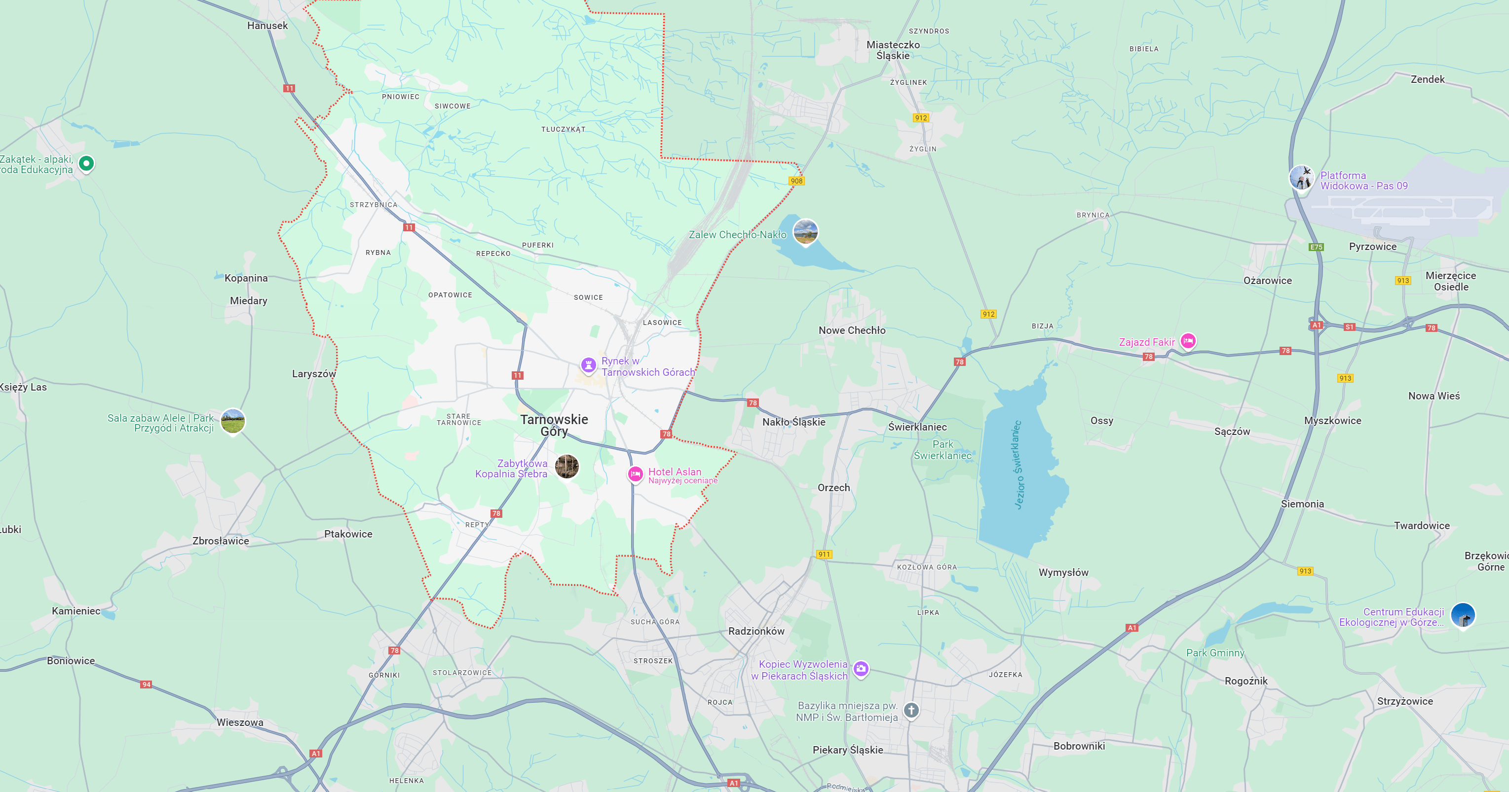 Mapa obszaru Tarnowskie Góry z oznaczonymi drogami i miejscowościami, wskazująca na główne szlaki komunikacyjne, w tym A1 oraz lokalne atrakcje turystyczne, idealna dla planowania wyjazdów i podróży.